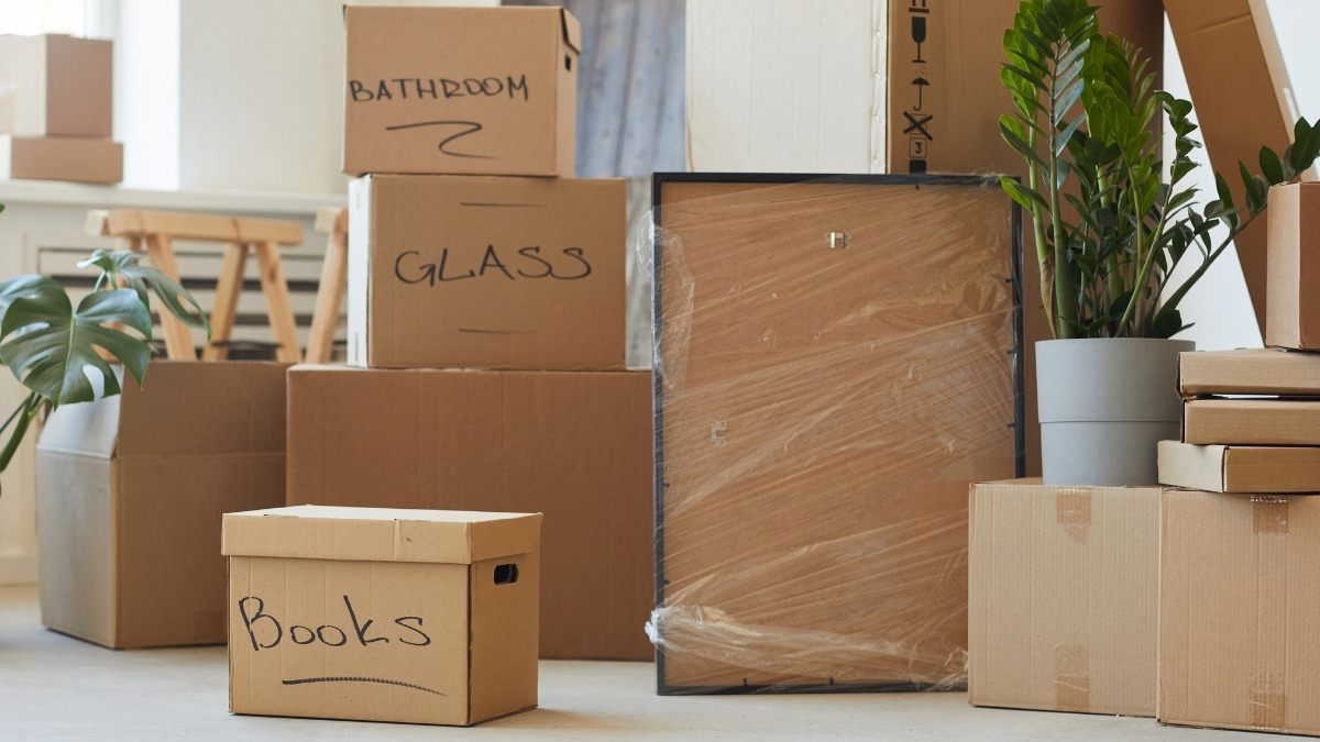 Stacked and labeled cardboard moving boxes
